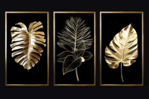 Three gold tropical leaf studies on black backgrounds arranged as a framed botanical triptych.
